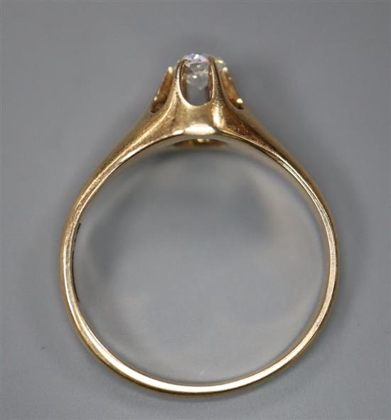 A 14k and claw set solitaire diamond ring, size I, gross 2.4 grams.